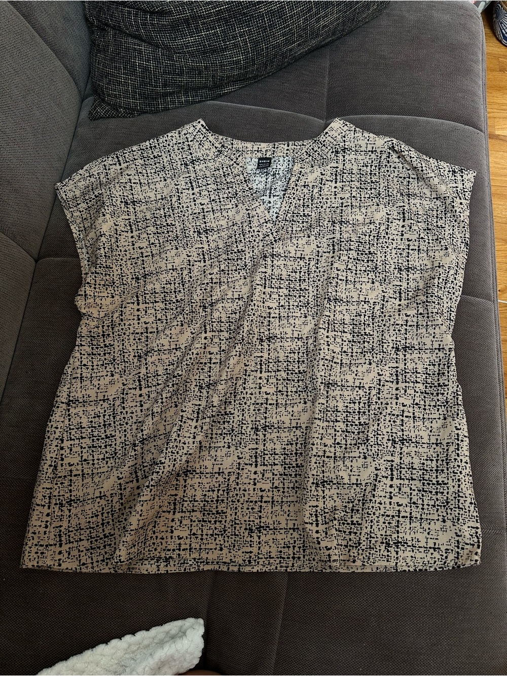 V-Neck Short Sleeve Blouse in Beige and Black Print.